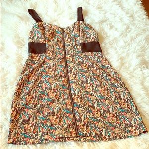 100% polyester. Front zipper. Short dress